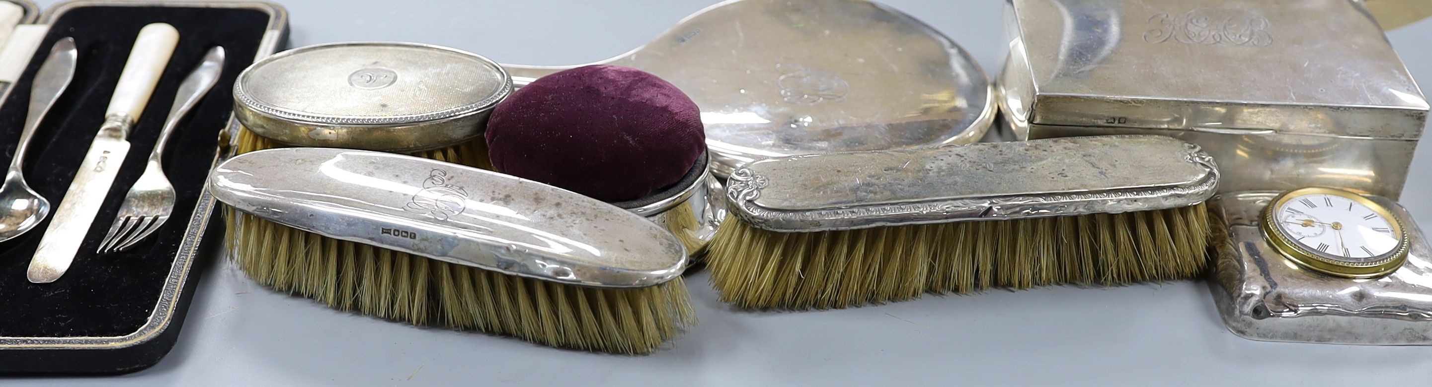 Sundry minor silver items including hand mirror, brushes, cigarette box, pin cushion, etc.